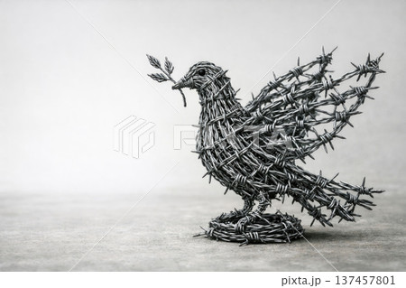 A pigeon made of barbed wire with a sprig of peace. Space for text. A pigeon made of barbed wire with a sprig of peace. Space for text. 137457801