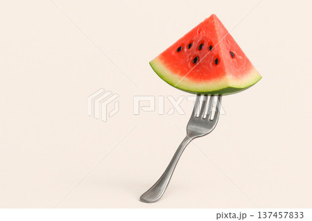 A piece of watermelon on a fork. Space for text. A piece of watermelon on a fork. Space for text. 137457833