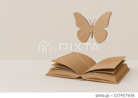 The butterfly flies out of the paper book. Space for text. 137457936
