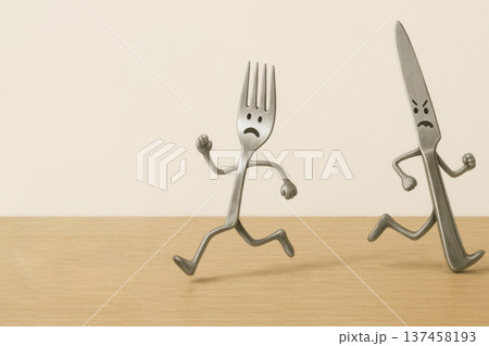 The fork runs away from the angry knife. Space for text. 137458193