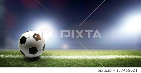 Soccer ball on the soccer field 137458621