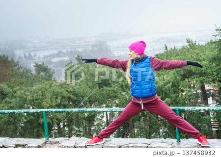 Woman exercising outside during autumn Woman exercising outside during autumn 137458932