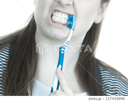 Woman brushing cleaning teeth. 137458990