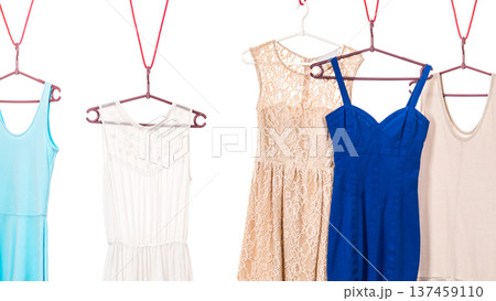 Colorful dresses hanging on clothes hanger 137459110