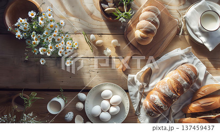 Freshly baked bread and eggs on rustic wooden table with flowers 137459437