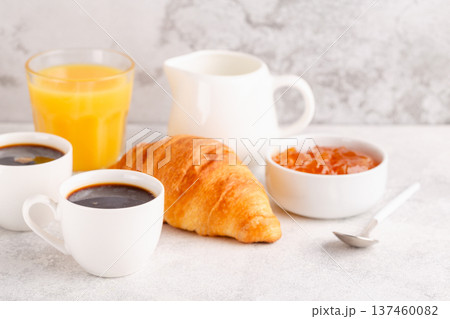 Hot coffee, croissants on a light background, selective focus. 137460082