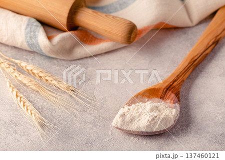 Ingredients for baking - flour, spoon, rolling pin. 137460121