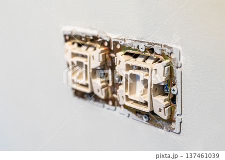 electrical switches closeup on painted wall electrical switches closeup on painted wall 137461039