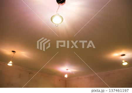 few ceiling light fixtures pulled out of holes 137461197