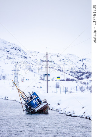 half-sunken ship on Sea coast in Teriberka village 137461239