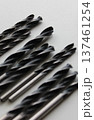 Black Drill Bits For Metal On Clean White Plastic Sheet WIth Selective Focus   137461254