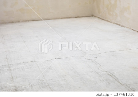 concrete screed in room with peeled flooring concrete screed in room with peeled flooring 137461310