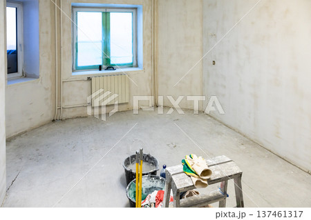 top view of plasterer's tools in concrete room 137461317