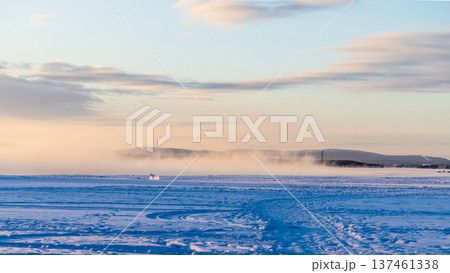 path on frozen Kandalaksha bay at winter sunrise path on frozen Kandalaksha bay at winter sunrise 137461338