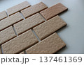 Wall tiles imitating the brickwork on a white surface angle view stock photo 137461369