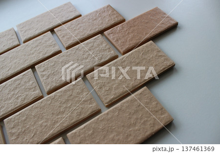 Wall tiles imitating the brickwork on a white surface angle view stock photo Wall tiles imitating the brickwork on a white surface angle view stock photo 137461369