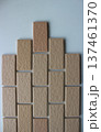 Construction Industry Concept Image. Triangle Rows Of Tiles In Form Of Bricks On White Wall Surface  137461370