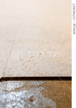 edge of cork floor tiles and sticky concrete floor edge of cork floor tiles and sticky concrete floor 137461627