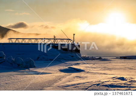 yellow sunrise over Kandalaksha Sea embankment yellow sunrise over Kandalaksha Sea embankment 137461671