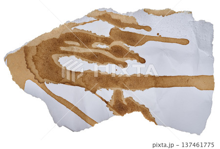 Torn piece of white paper spilled with black coffee Torn piece of white paper spilled with black coffee 137461775