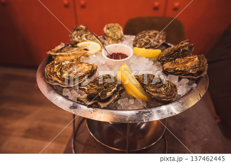 Fresh Raw Oysters with Citron, Baguette, Butter, and Cider 137462445
