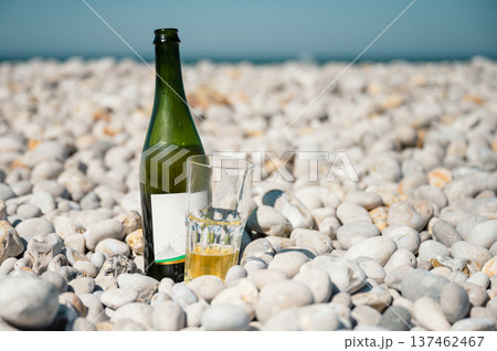 Bottle and glass of cider on Etretat beach Bottle and glass of cider on Etretat beach 137462467