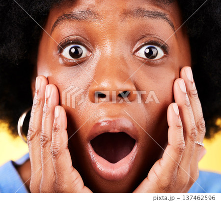 Scared, shock and surprised woman in studio for fear, mental health or closeup. Portrait of African person on yellow background with mouth open, hands on face with a phobia, gossip news or horror Scared, shock and surprised woman in studio for fear, mental health or closeup. Portrait of African person on yellow background with mouth open, hands on face with a phobia, gossip news or horror 137462596