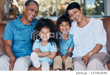 Happy, portrait and grandparents with children on sofa for smile, bonding and peace on holiday. Love, care and happiness with family in living room at home for vacation, cuddle and embrace together 137462646