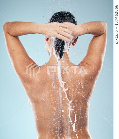 Hair care, shampoo or woman washing in shower for wellness or healthy head on blue background. Cosmetics, beauty model or back of wet person washing or grooming for natural hygiene to relax in studio 137462666