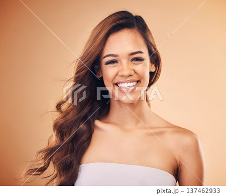 Hair, care and happy woman in portrait with beauty, cosmetics or balayage hairstyle in studio background. Skincare, makeup and laughing with happiness or smile for collagen treatment or dermatology 137462933