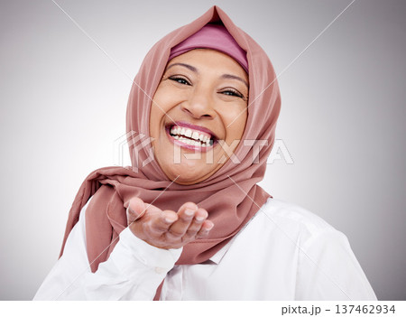 Muslim woman, portrait and blowing a kiss in studio with happiness, kindness or positive attitude. Hijab, islam and fashion of a mature person on grey background for beauty, cosmetics or flirting Muslim woman, portrait and blowing a kiss in studio with happiness, kindness or positive attitude. Hijab, islam and fashion of a mature person on grey background for beauty, cosmetics or flirting 137462934