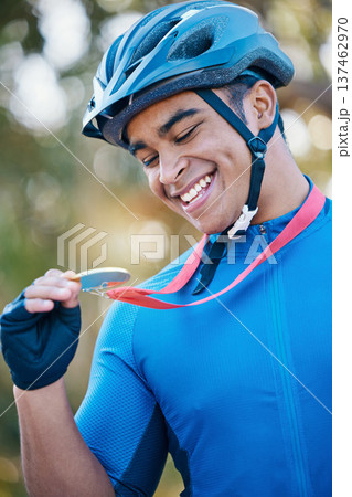 Winner, medal or happy man cyclist in celebration of victory performance or success in tournament race. Excited, gold award or proud sports athlete winning a cycling competition with smile or reward 137462970