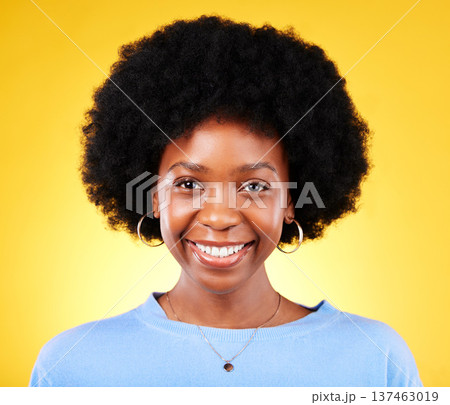 Portrait, smile and young black woman in studio with afro, good mood and cool personality on yellow background. Face of happy, confident and modern African model with pride, curly natural hair or joy 137463019
