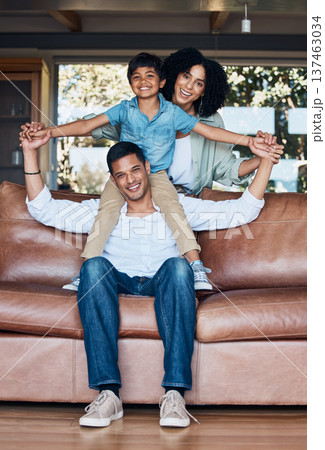 Support, airplane and portrait with family on sofa for happy, smile or peace on holiday. Love, care and playful with parents and child in living room at home for vacation, cuddle and embrace together 137463034