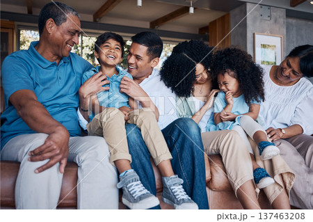 Laughing, big family and on a home sofa for conversation, visit or bonding. Happy, together and parents, children and grandparents on a couch for a joke, comedy or communication in the living room 137463208