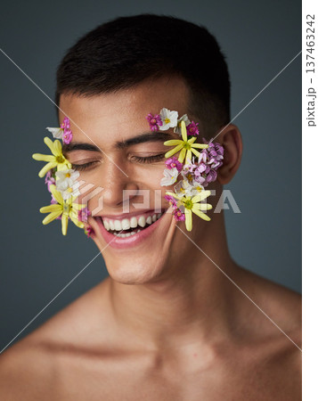 Face, happy man and flowers, beauty and nature, cosmetics and headshot with art deco isolated on studio background. Natural aesthetic, dermatology with eco friendly skincare and clean with spring Face, happy man and flowers, beauty and nature, cosmetics and headshot with art deco isolated on studio background. Natural aesthetic, dermatology with eco friendly skincare and clean with spring 137463242