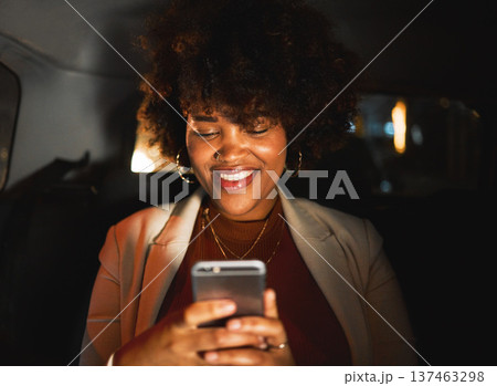 Black woman, afro and phone at night in taxi, travel or communication in social media or networking. Happy African female person smile in online chatting or late evening on mobile smartphone in car 137463298