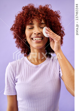 Skincare, cotton and happy woman in studio for cleaning, wellness or cosmetic on purple background. Beauty, smile and lady model with facial swab for toner, cleanse or face pad for makeup application 137463344