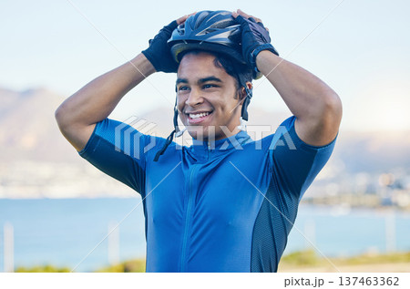 Cycling helmet, exercise and a man outdoor for sports, workout or training with a happy smile. face of a young athlete or cyclist with safety, wellness and fitness at park or thinking of performance 137463362