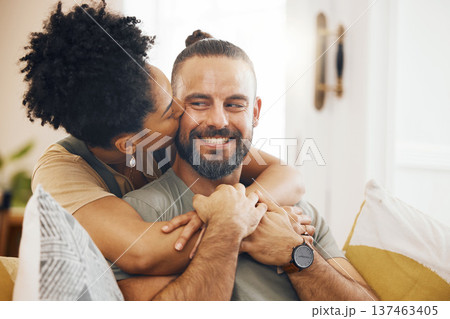 Interracial couple, hug and kiss, happy on couch and relax at home with bonding, commitment and affection. Healthy relationship, marriage and love with care and trust, people in lounge with romance Interracial couple, hug and kiss, happy on couch and relax at home with bonding, commitment and affection. Healthy relationship, marriage and love with care and trust, people in lounge with romance 137463405