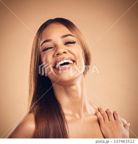 Portrait, beauty and hair with a natural woman in studio on a brown background for keratin treatment. Face, smile and shampoo with a happy young model at the salon for growth or aesthetic haircare Portrait, beauty and hair with a natural woman in studio on a brown background for keratin treatment. Face, smile and shampoo with a happy young model at the salon for growth or aesthetic haircare 137463512