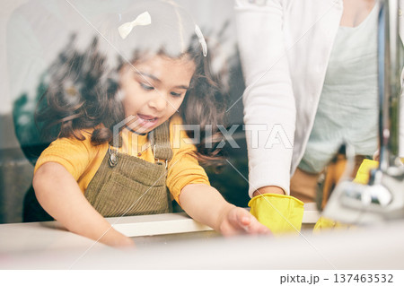 Girl, learning and washing dishes with mom in kitchen, help or show skills in house for development. Cleaning, mother and daughter by sink, hygiene or teaching with support, bacteria or dirt in home Girl, learning and washing dishes with mom in kitchen, help or show skills in house for development. Cleaning, mother and daughter by sink, hygiene or teaching with support, bacteria or dirt in home 137463532