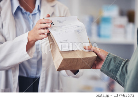 Pharmacy, hands and prescription medicine for customer with paper bag for healthcare, drugs and pharmaceutical. Closeup of a pharmacist or medical worker with person in drugstore for retail service 137463572