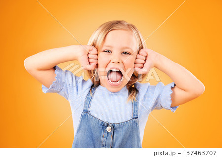 Portrait, girl and kid with anger, screaming or emoji with emotion on a yellow studio background. Face, person or model with stress, frustrated or shouting with a child, facial expression or attitude Portrait, girl and kid with anger, screaming or emoji with emotion on a yellow studio background. Face, person or model with stress, frustrated or shouting with a child, facial expression or attitude 137463707