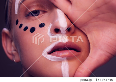 Face, paint and woman with creative makeup, beauty or artist with freedom of expression in tribal cosmetics. Art, portrait and artistic model with creativity in skincare or dermatology aesthetic 137463740