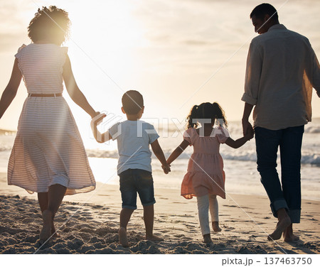 Sunset, beach and back of family holding hands in nature for travel, bond and fun together. Rear view, love and children with parents at the ocean for sunrise walk, relax and enjoy freedom in Mexico Sunset, beach and back of family holding hands in nature for travel, bond and fun together. Rear view, love and children with parents at the ocean for sunrise walk, relax and enjoy freedom in Mexico 137463750