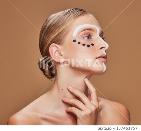 Creativity, makeup and young woman in studio with art, beauty and abstract face aesthetic. Cosmetic, artistic and headshot of female model from Australia with facial paint by brown background. Creativity, makeup and young woman in studio with art, beauty and abstract face aesthetic. Cosmetic, artistic and headshot of female model from Australia with facial paint by brown background. 137463757