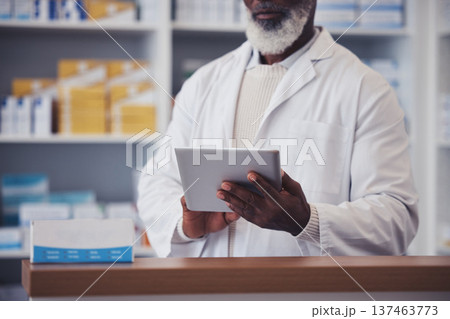 Hands, senior man and pharmacist with digital tablet for medicine inventory and pills database in pharmacy. Closeup, person and healthcare with internet technology for supply chain and research 137463773