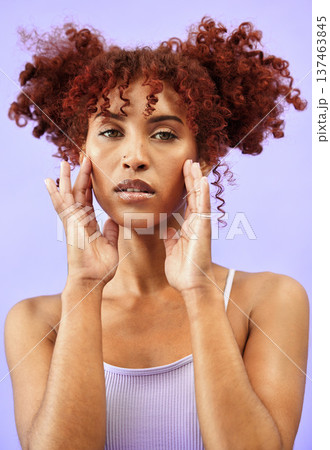 Woman, hair and beauty with hands on face in a studio, red curls and dermatology with makeup isolated on purple background. Haircare, cosmetics and curly hairstyle with model from Brazil in portrait Woman, hair and beauty with hands on face in a studio, red curls and dermatology with makeup isolated on purple background. Haircare, cosmetics and curly hairstyle with model from Brazil in portrait 137463845