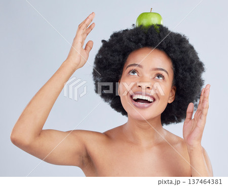 Apple, balance and black woman with health, organic and diet for wellness and healthy in studio. Excited, smile and happy model with green fruit, skin nutrition and vegan food with grey background Apple, balance and black woman with health, organic and diet for wellness and healthy in studio. Excited, smile and happy model with green fruit, skin nutrition and vegan food with grey background 137464381